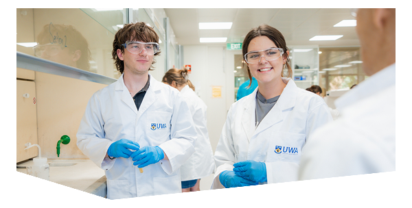 Two undergraduate chemistry students: hands-on lab learning in the Bayliss Building. Class - Introductory Chemistry